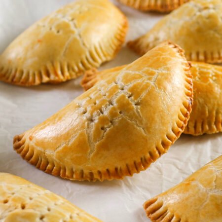 Medium-sized meat pie with golden crust